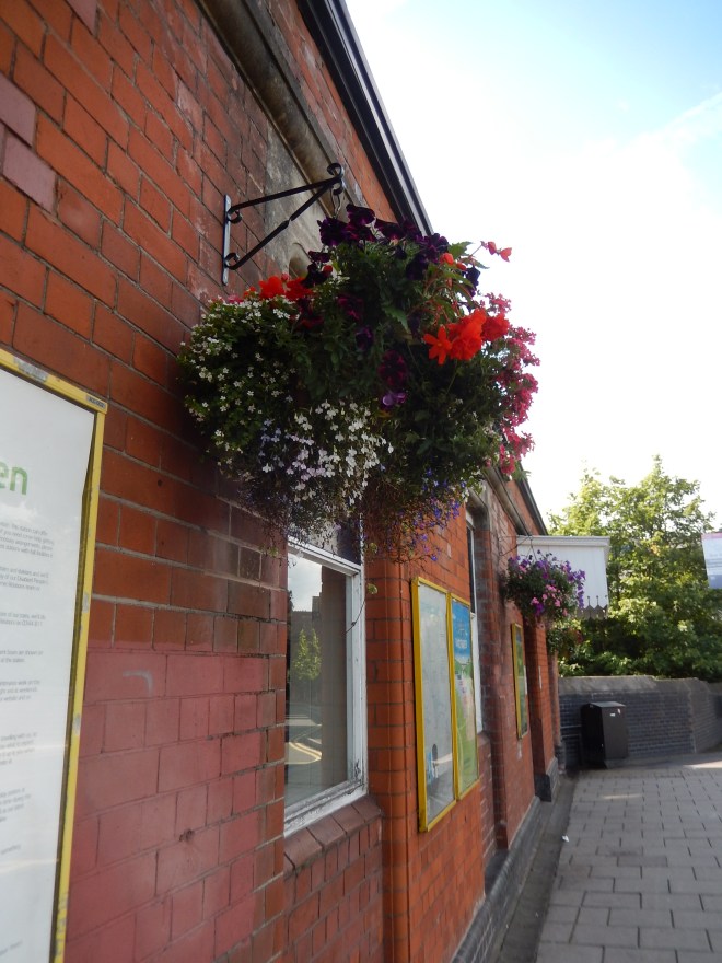 Hanging baskets at Acocks Green Train Station