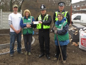Volunteers - Phil, Fran and Ann being presented cheque from Sgt Fellows and PCSO Large