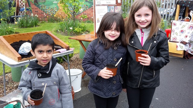 Children sowing nasturtium seeds